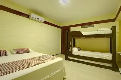 Uma cama ou camas num quarto em Linda no BEACH PARK-16 pessoas - HOUSINGCEARÁ
