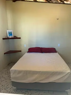 Uma cama ou camas num quarto em Aconchego Praia do Balbino