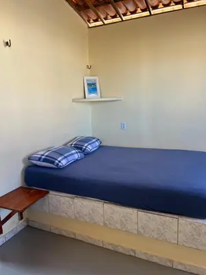 Uma cama ou camas num quarto em Aconchego Praia do Balbino