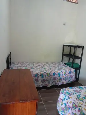 Uma cama ou camas num quarto em Chalé Primavera