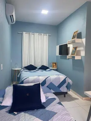 Uma cama ou camas num quarto em Chale Vista ao Mar Blue