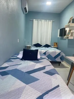 Uma cama ou camas num quarto em Chale Vista ao Mar Blue