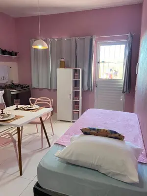 Uma cama ou camas num quarto em Chale Vista ao Mar Pink