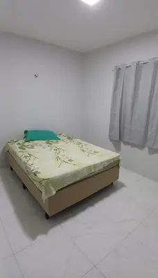 Uma cama ou camas num quarto em Casa Praia Paracuru