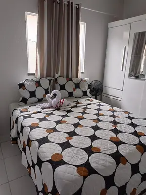 Uma cama ou camas num quarto em Casa de ferias Tarciane Horizonte Ceara