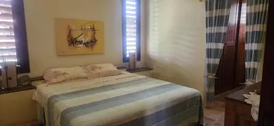 Uma cama ou camas num quarto em Villaggio Lagoa Das Palmeiras