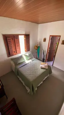 Uma cama ou camas num quarto em Vila Alizius
