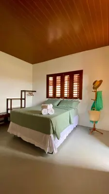 Uma cama ou camas num quarto em Vila Alizius