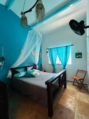 Uma cama ou camas num quarto em chalet pousada Coisa mais linda
