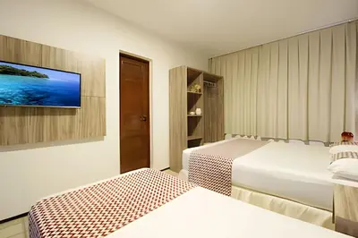 Uma cama ou camas num quarto em MansãoVistaMar-BEACH PARK-35Pessoas - HOUSINGCEARÁ