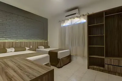 Uma cama ou camas num quarto em Aconchegante-8Suítes-28Pessoas - HOUSINGCEARÁ