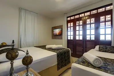 Uma cama ou camas num quarto em Mansão Luxo 32 Pessoas-BeachPARK - BY HousingCeara