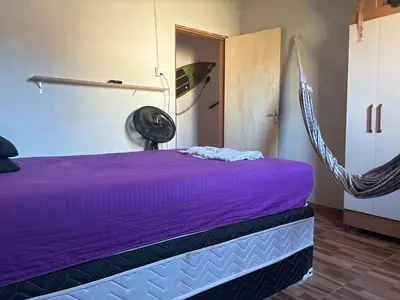 Uma cama ou camas num quarto em Vieira Mar jorlandia