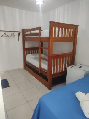 Uma cama ou camas num quarto em Pousada Brad Pitt