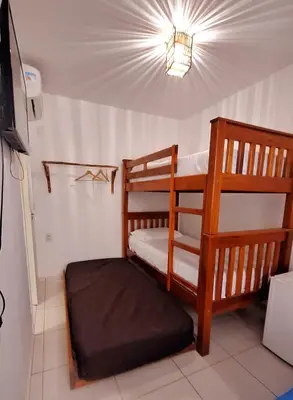 Uma cama ou camas num quarto em Pousada Brad Pitt