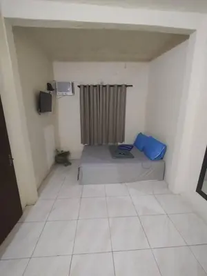 Uma área de estar em Kitnet's 3 do Faustino