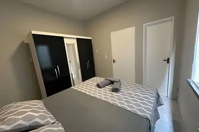 Uma cama ou camas num quarto em Completa Perfeita para Turismo de Negócios e Lazer por Will