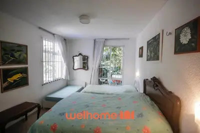 Uma cama ou camas num quarto em Casa em Guaramiranga com Piscina Coberta