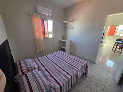 Uma cama ou camas num quarto em Residencial Vicente Mota Neto