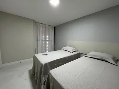 Uma cama ou camas num quarto em Atlântico Vista Mar