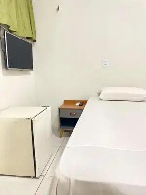 Uma cama ou camas num quarto em Por do Sol Praia Hotel