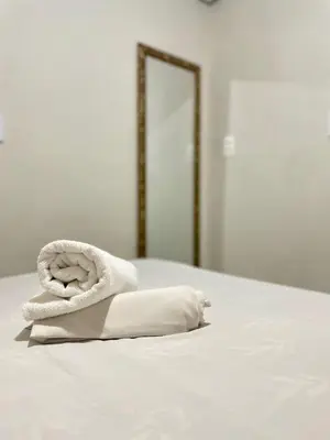 Uma cama ou camas num quarto em Por do Sol Praia Hotel