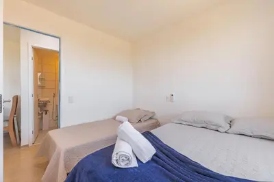 Uma cama ou camas num quarto em Mirante #1404 - Fortaleza por Carpediem