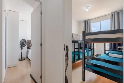 Uma cama ou camas num quarto em Mirante #804 - Apto em Fortaleza por Carpediem