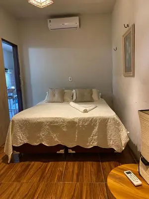 Uma cama ou camas num quarto em Casa de praia do pescador