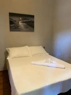 Uma cama ou camas num quarto em Casa de praia do pescador