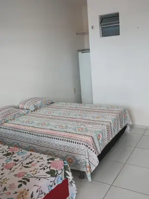Uma cama ou camas num quarto em Pousada Brisa da Barra