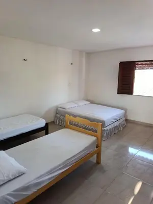 Uma cama ou camas num quarto em Casa dunna azul