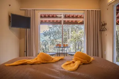 Uma cama ou camas num quarto em Complexo Claudia Leal na serra de Guaramiranga