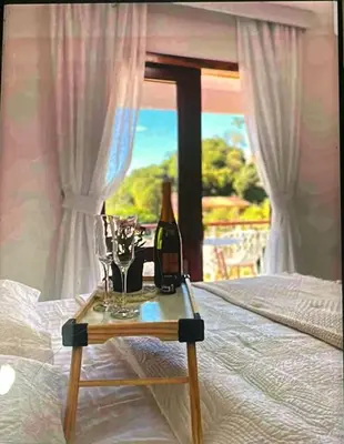 Uma cama ou camas num quarto em Complexo Claudia Leal na serra de Guaramiranga