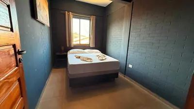 Uma cama ou camas num quarto em pousada calango