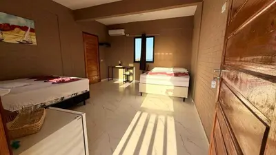 Uma cama ou camas num quarto em pousada calango