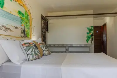 Uma cama ou camas num quarto em Mansao Santa Rita