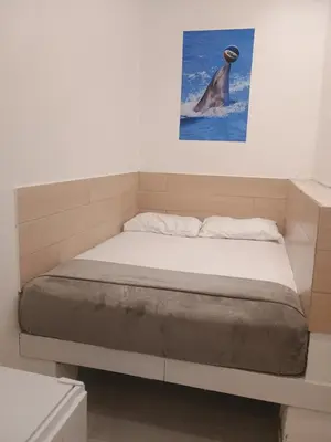 Uma cama ou camas num quarto em Hotel Dolphin Fortaleza