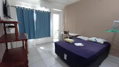 Uma cama ou camas num quarto em Pousada Virgínia