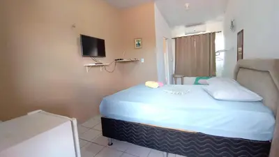 Uma cama ou camas num quarto em Pousada Virgínia