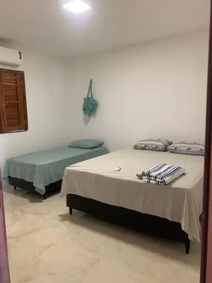 Uma cama ou camas num quarto em Casa Portal da Lagoinha