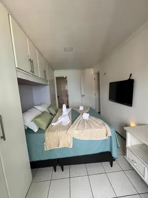 Uma cama ou camas num quarto em Apartamento vista mar no mucuripe
