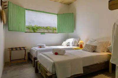 Uma cama ou camas num quarto em Casa Mangará