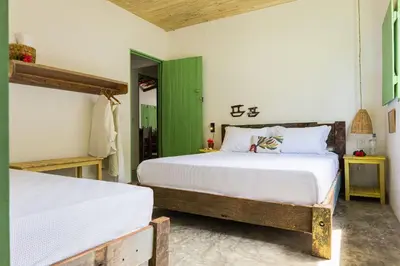 Uma cama ou camas num quarto em Casa Mangará