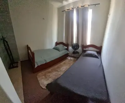 Uma cama ou camas num quarto em Praia do Futuro apartamento para amigos e familiares