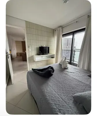 Uma televisão e/ou sistema de entretenimento em Apartamento 21 Fortaleza