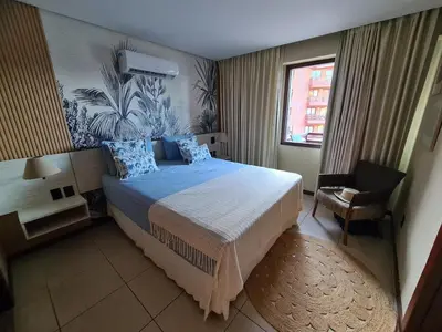 Uma cama ou camas num quarto em Kariri-Beautiful 1 bedroom flat, beachfront