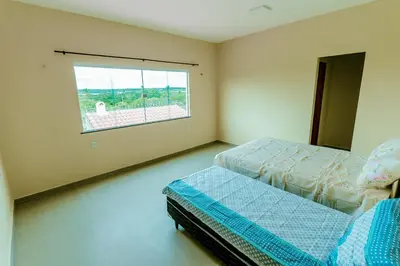 Uma cama ou camas num quarto em Casa em Barra Nova