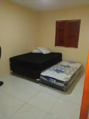 Uma cama ou camas num quarto em André Safadão Turismo