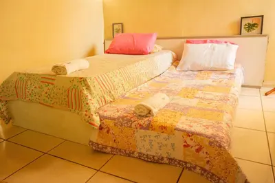 Uma cama ou camas num quarto em Casa de Hospedagem Cajueiro